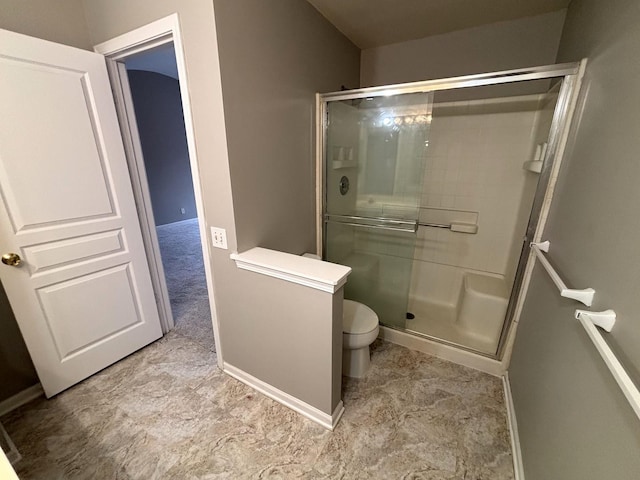 bathroom with toilet and walk in shower