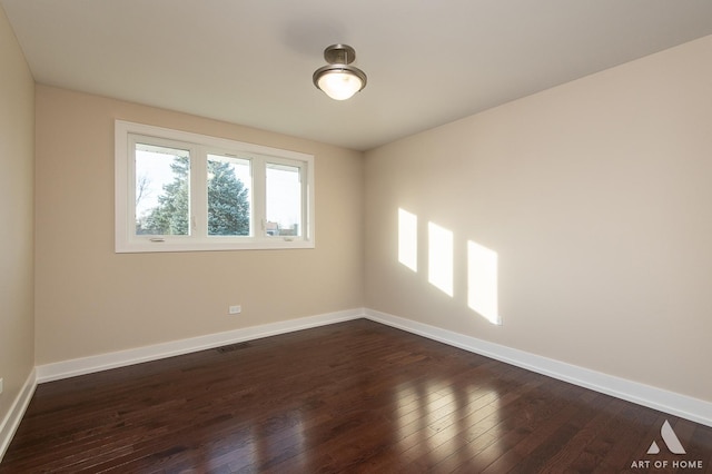 empty room featuring dark hardwood / wood-style floors