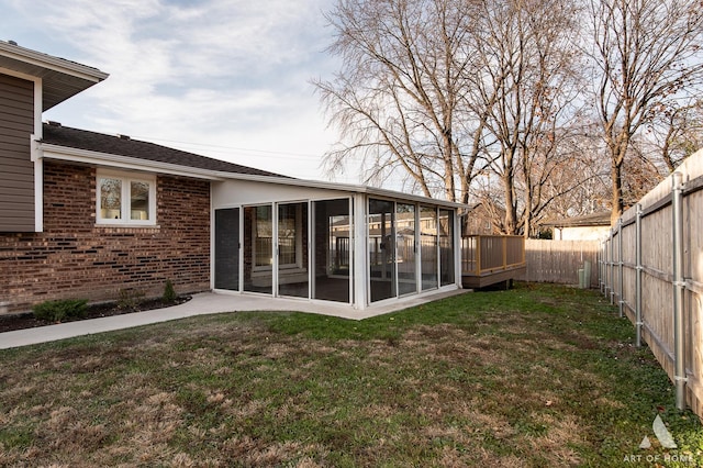 view of yard featuring a sunroom