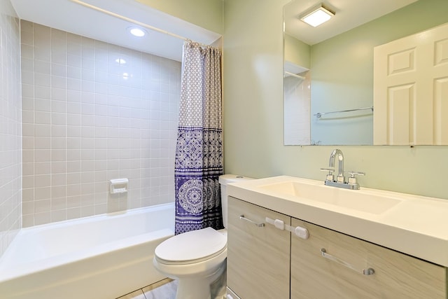 full bathroom with vanity, shower / bath combo, and toilet