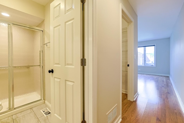 hall with light wood-type flooring