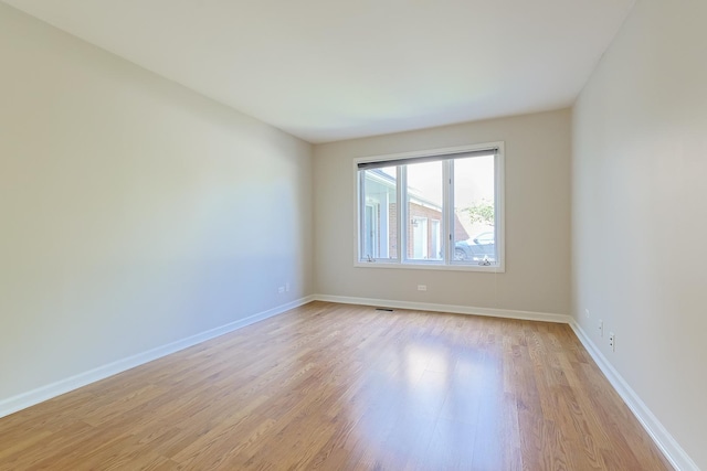 empty room with light wood-type flooring