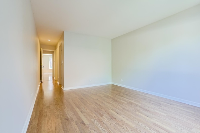 unfurnished room with light hardwood / wood-style flooring