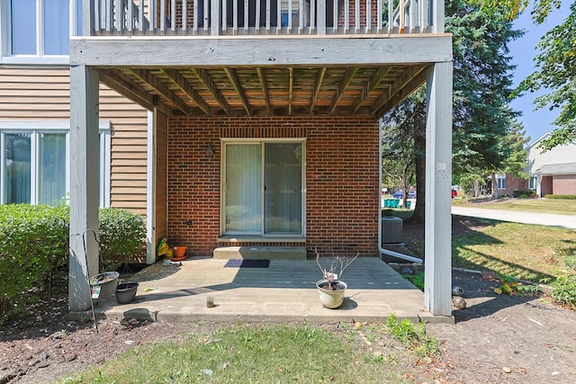 entrance to property featuring a patio area