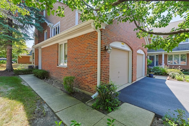 view of side of property with central AC unit