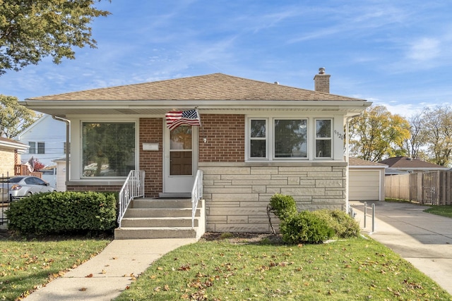 bungalow-style home featuring a front yard and a garage