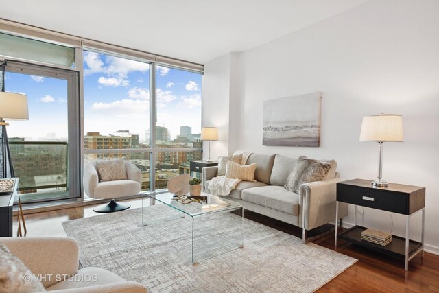 dining space with expansive windows and light hardwood / wood-style flooring