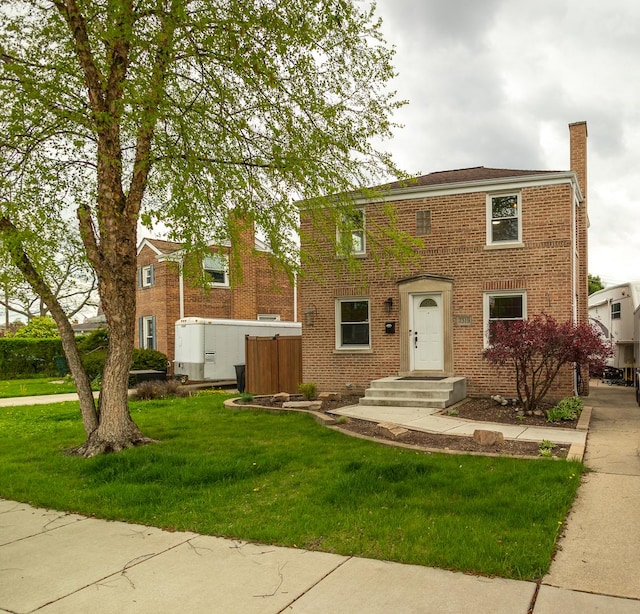 view of front facade featuring a front yard