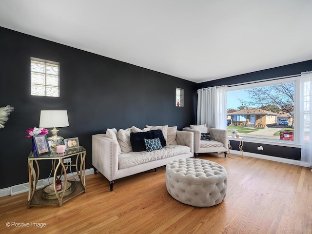 living room with light hardwood / wood-style flooring