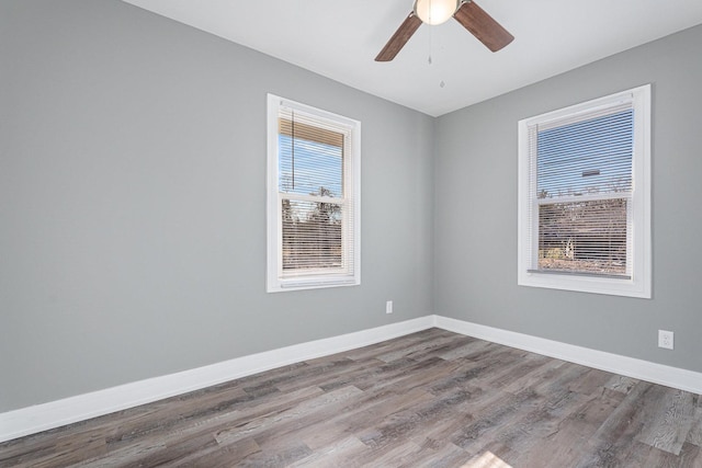 spare room featuring ceiling fan and hardwood / wood-style floors