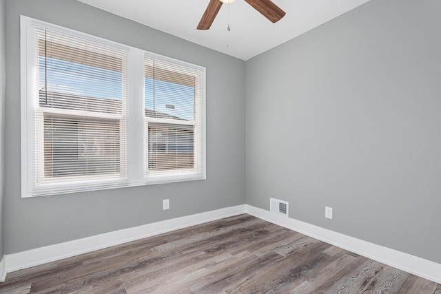 unfurnished room featuring ceiling fan and hardwood / wood-style floors