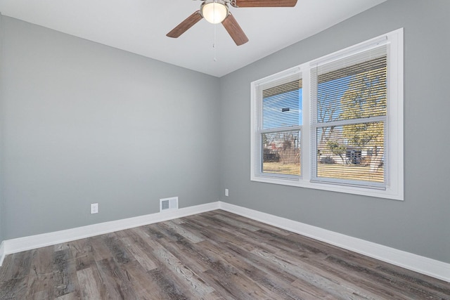 spare room with ceiling fan and hardwood / wood-style floors