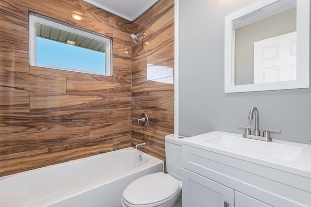 full bathroom featuring vanity, toilet, and tiled shower / bath