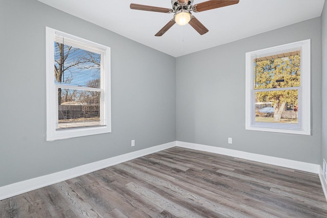 spare room featuring hardwood / wood-style flooring and ceiling fan