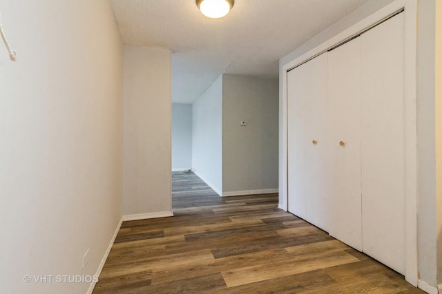 hallway featuring dark wood-type flooring