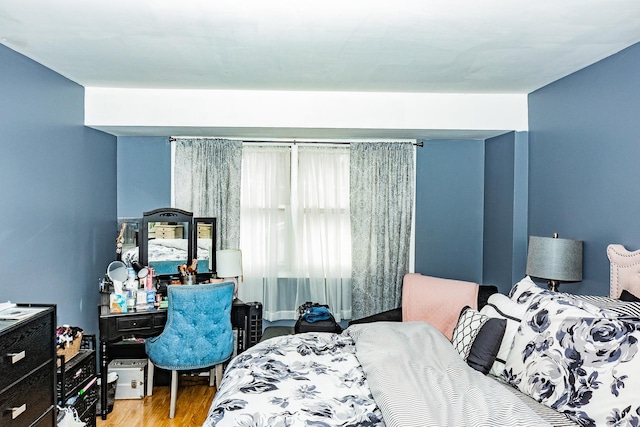 bedroom with light wood-style floors