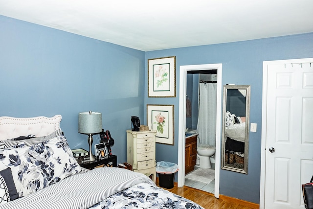 bedroom featuring wood finished floors