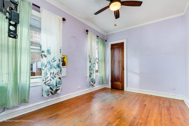 unfurnished room featuring hardwood / wood-style flooring, ceiling fan, and ornamental molding