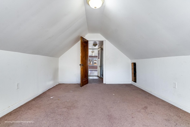 bonus room featuring carpet and vaulted ceiling