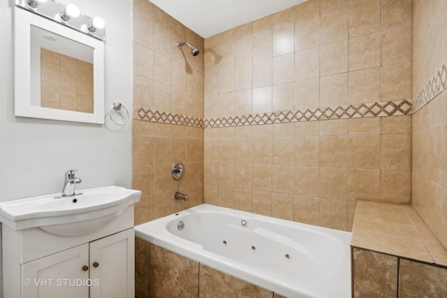 bathroom with vanity and tiled shower / bath combo