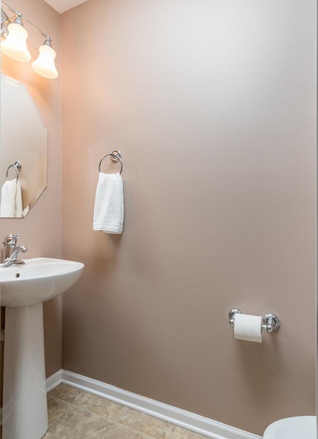 bathroom featuring tile patterned flooring and sink