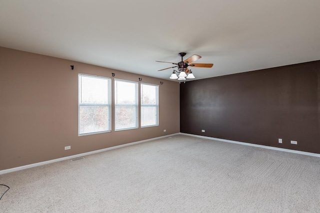 carpeted empty room with ceiling fan