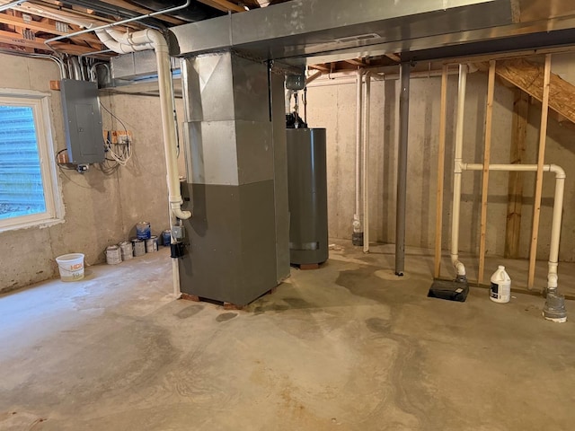 basement featuring electric panel, heating unit, and gas water heater