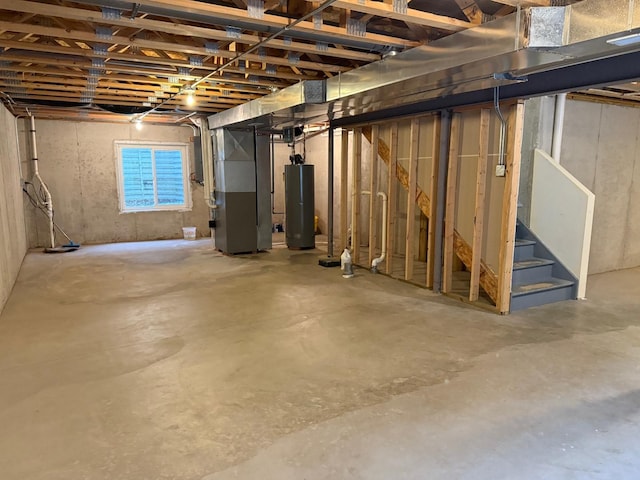 basement with gas water heater and heating unit