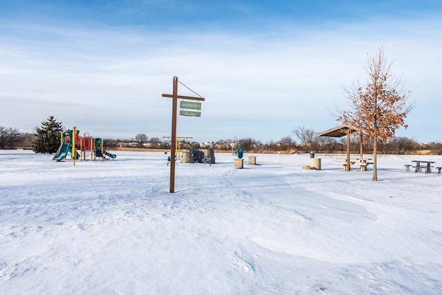 snowy yard with a playground