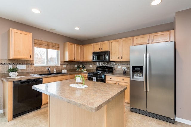 kitchen featuring backsplash, sink, black appliances, light brown cabinets, and a center island