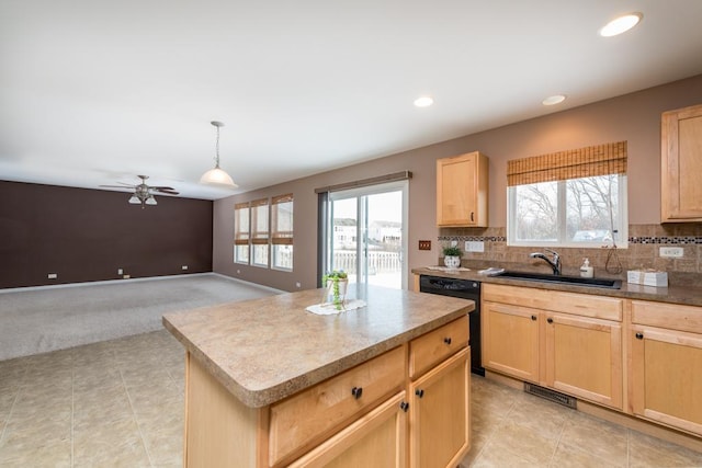 kitchen featuring a kitchen island, sink, black dishwasher, and light brown cabinetry