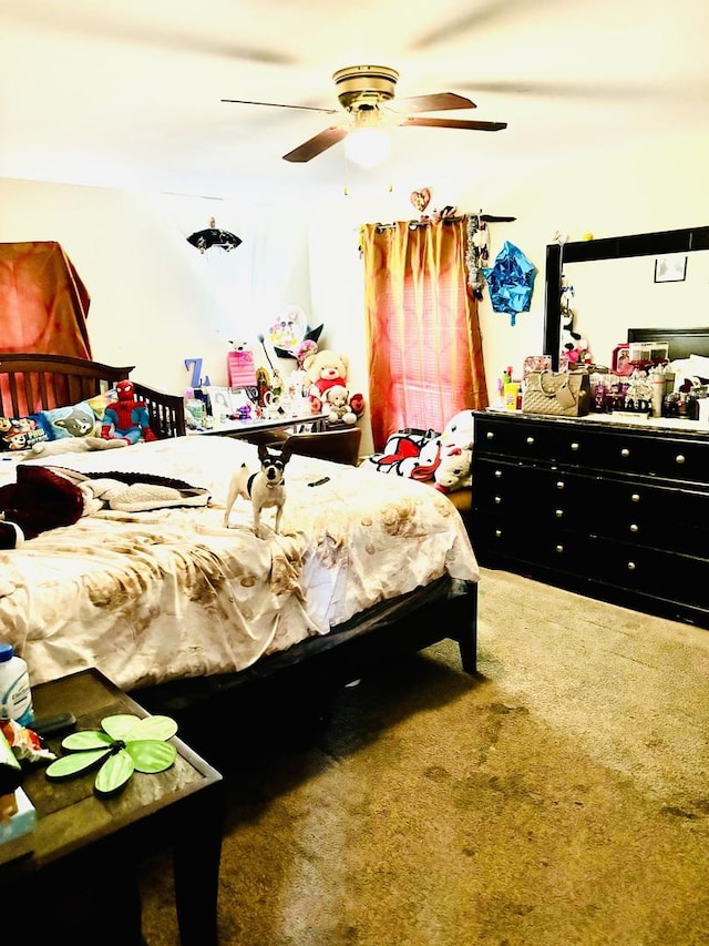 bedroom with ceiling fan and carpet floors