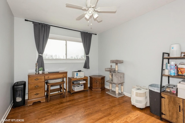 home office featuring ceiling fan and hardwood / wood-style floors