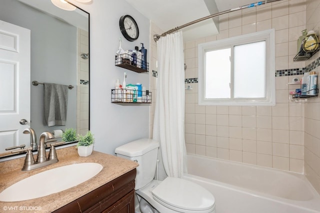 full bathroom featuring vanity, toilet, and shower / bathtub combination with curtain