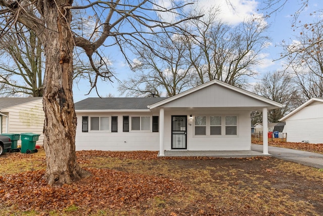 ranch-style house featuring a carport