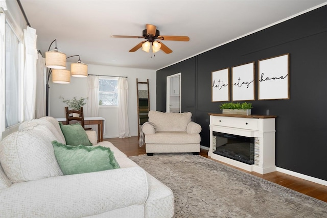 living room featuring hardwood / wood-style flooring and ceiling fan