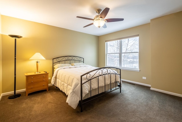 bedroom with dark carpet and ceiling fan