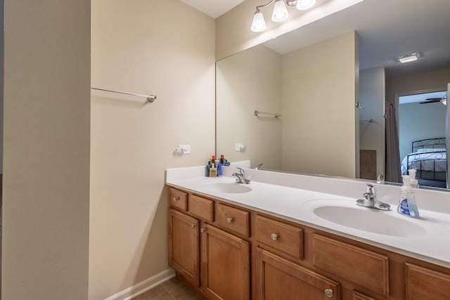 bathroom featuring tile patterned flooring and vanity