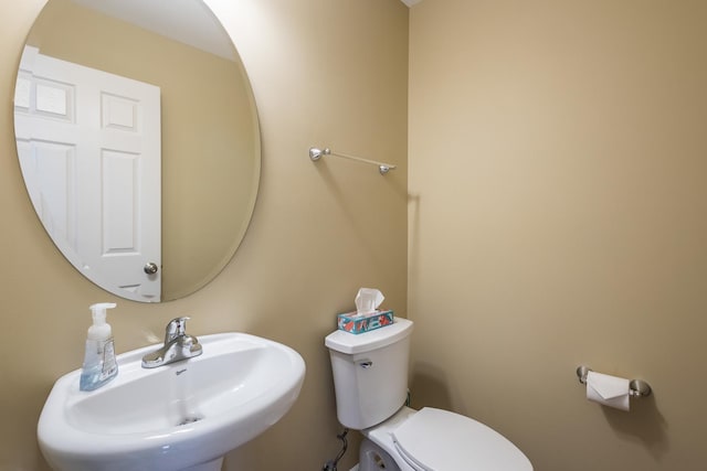 bathroom with sink and toilet