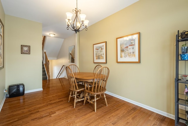 dining room featuring an inviting chandelier and hardwood / wood-style floors