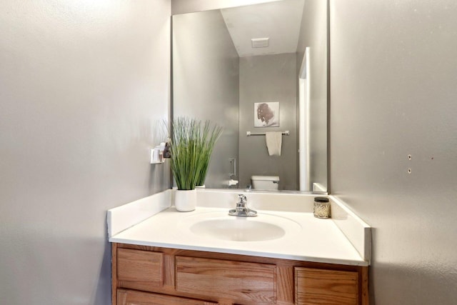 bathroom with vanity and toilet