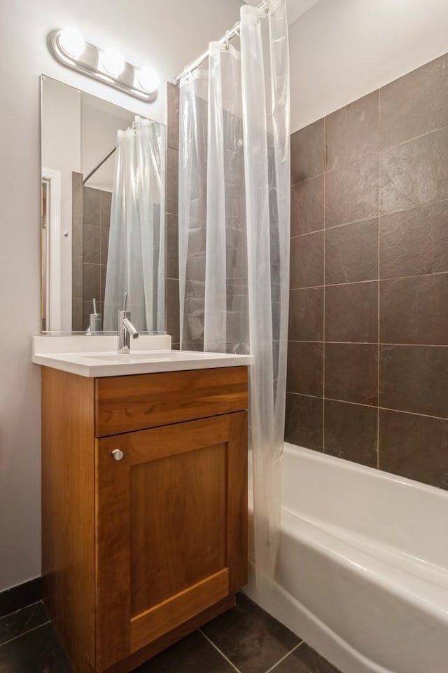 bathroom featuring tile patterned floors, vanity, and shower / tub combo