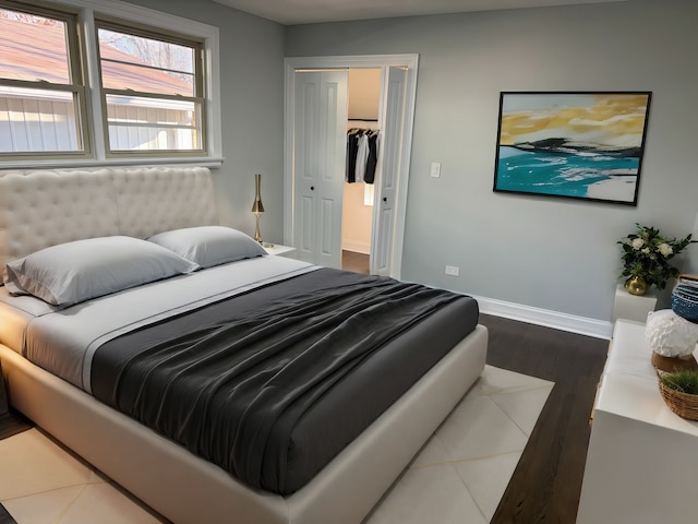 bedroom featuring a closet and dark wood-type flooring