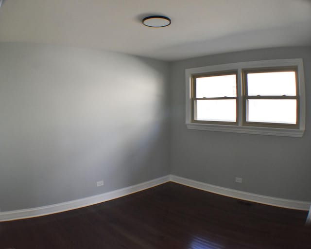 unfurnished room featuring hardwood / wood-style flooring