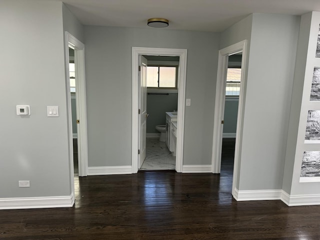 corridor featuring dark hardwood / wood-style floors