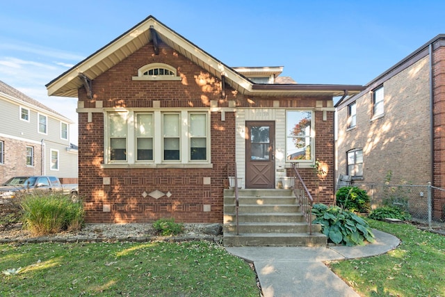 entryway featuring brick wall and concrete flooring