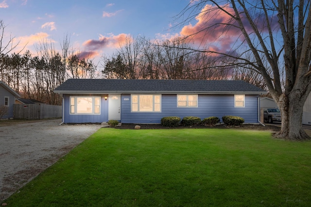 ranch-style house with a yard