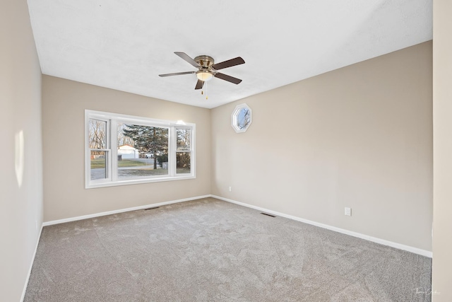 unfurnished room with carpet and ceiling fan