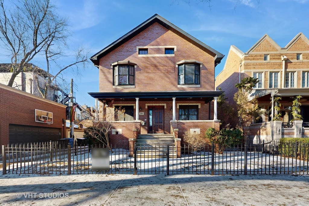 3814 N Janssen Ave, Chicago, IL 60613 - view of front facade with covered porch and a garage