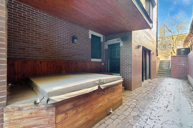 view of patio with a hot tub